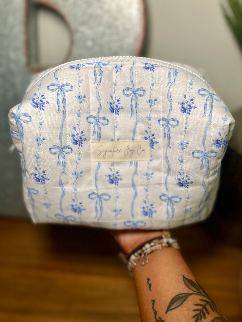 Blue Ribbon Bloom Quilted Makeup Bag | Signature Pouch