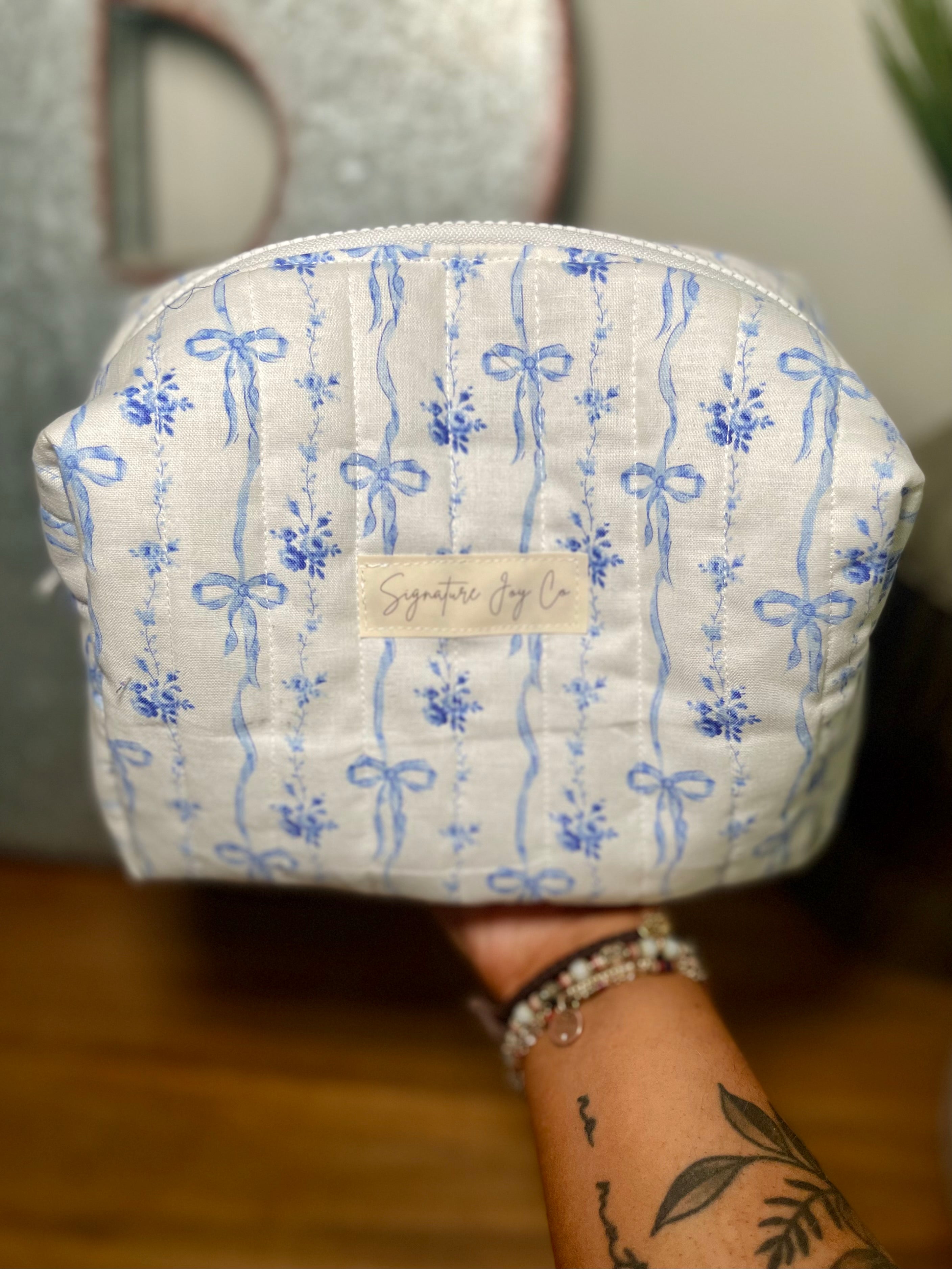 Blue Ribbon Bloom Quilted Makeup Bag | Signature Pouch