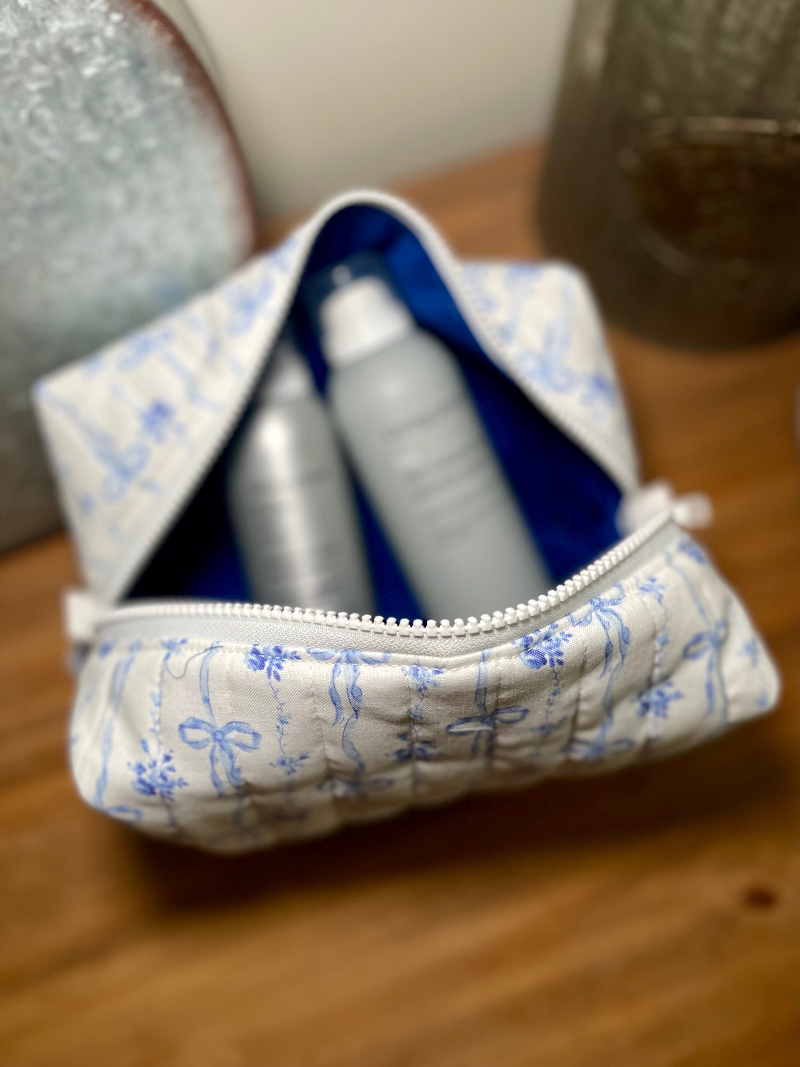 Blue Ribbon Bloom Quilted Makeup Bag | Signature Pouch
